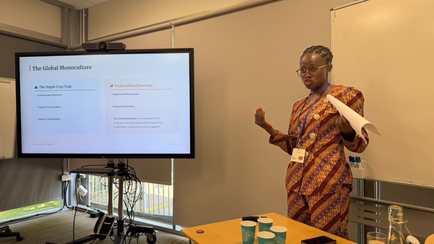 Saada presenting research on food systems and underutilized crops at a conference